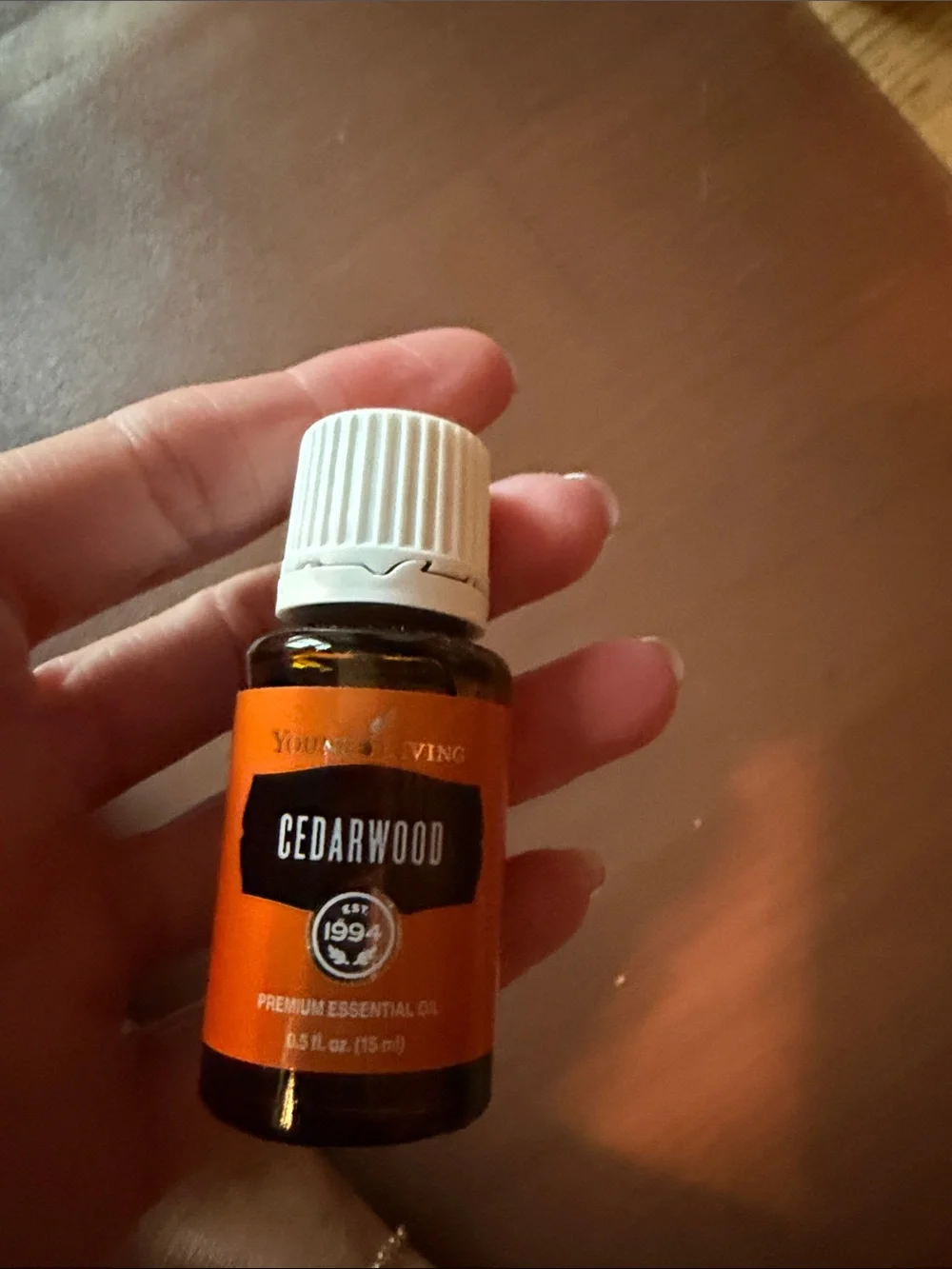 Young Living Cedarwood Essential Oil - Orange and White
